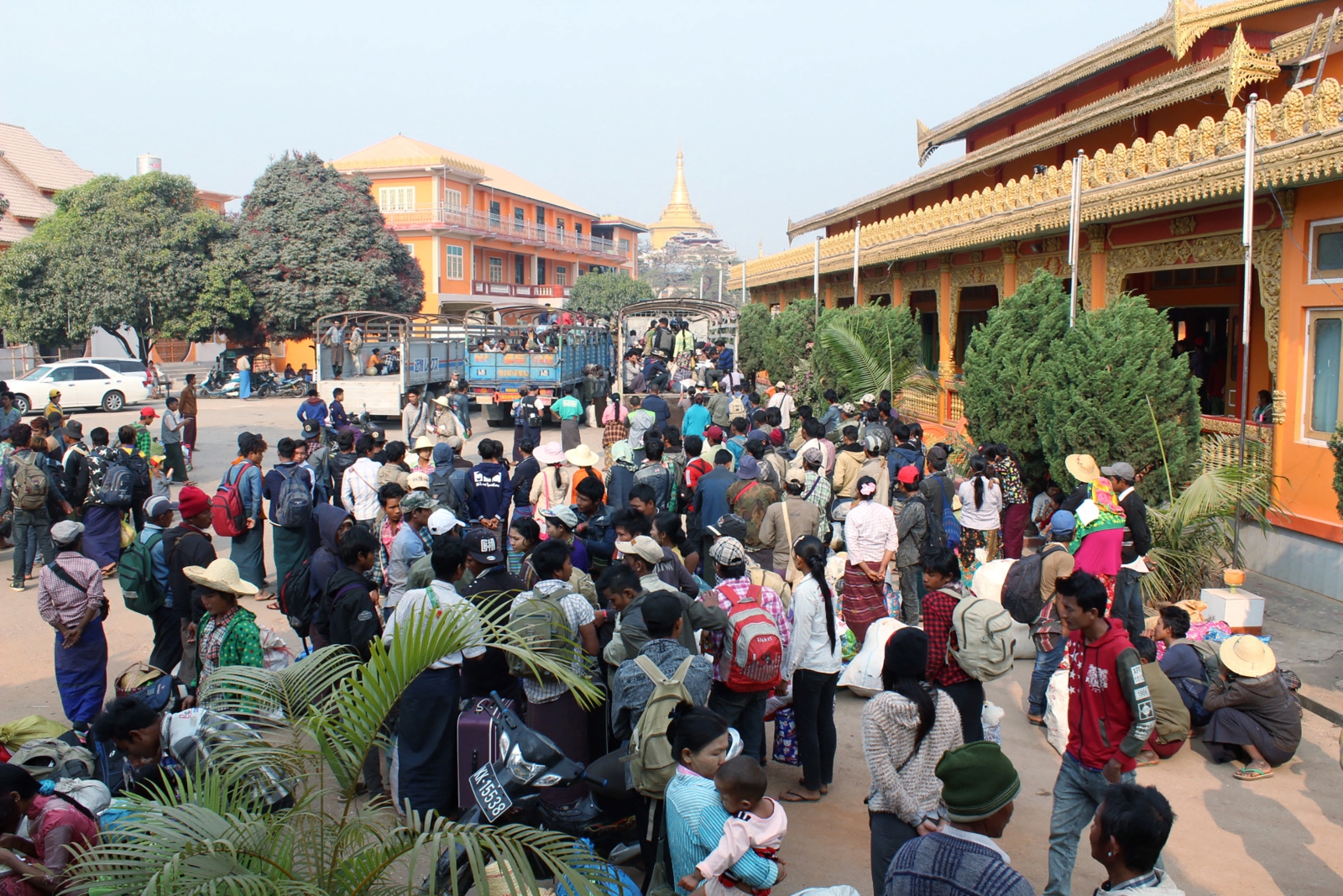 Residents who fled from conflict areas near the Chinese border gather in Lashio town on March 8, 2017. (AFP)