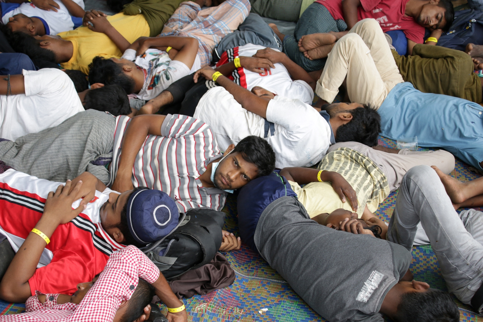 Newly-arrived Rohingya refugees rest at a local fishermen's hall in Lapang Barat, in the Indonesian province of Aceh, on November 20. (AFP)