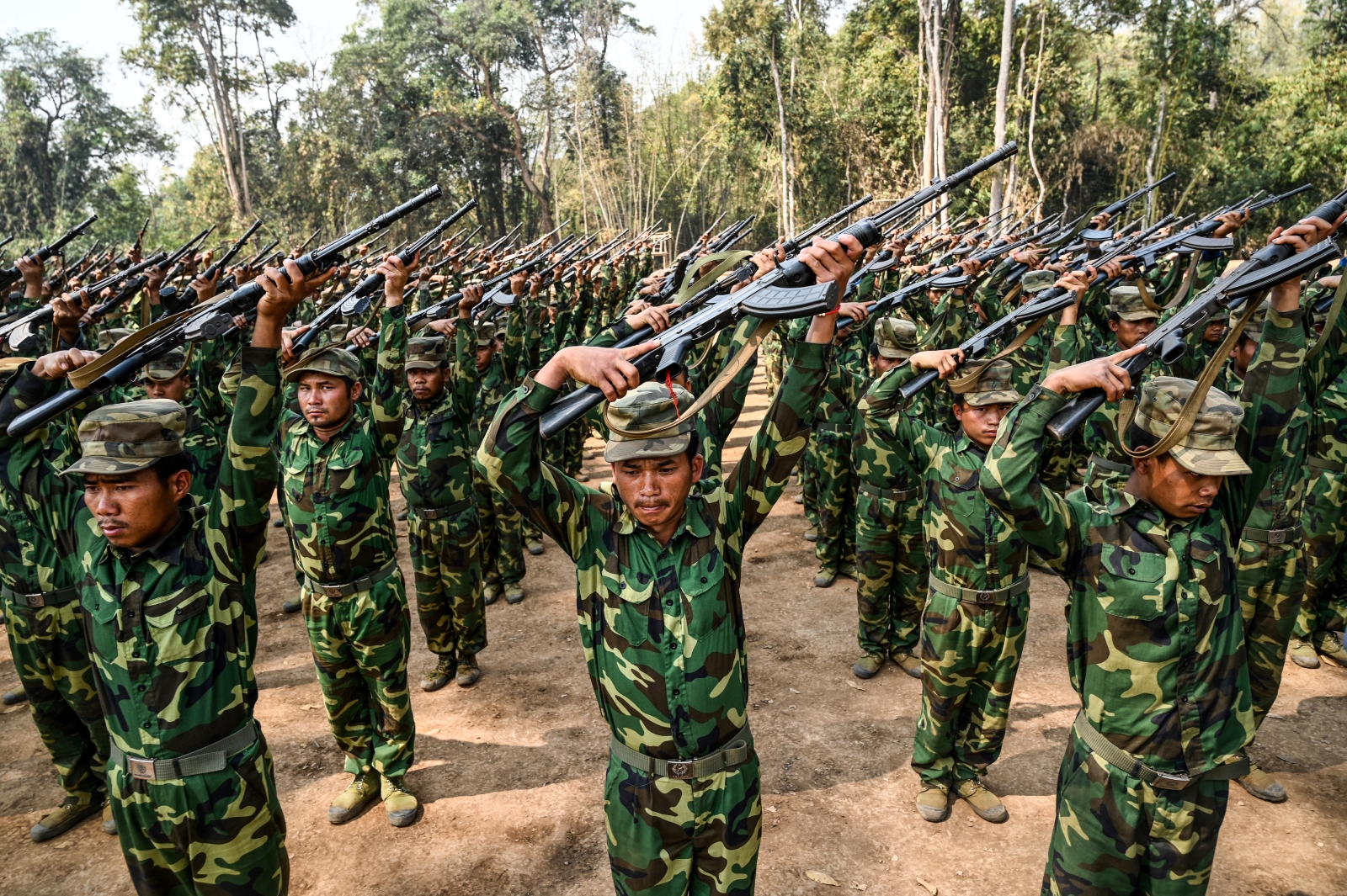 Members of the TNLA take part in a training exercise at their base camp in northern Shan State on March 8. (AFP)