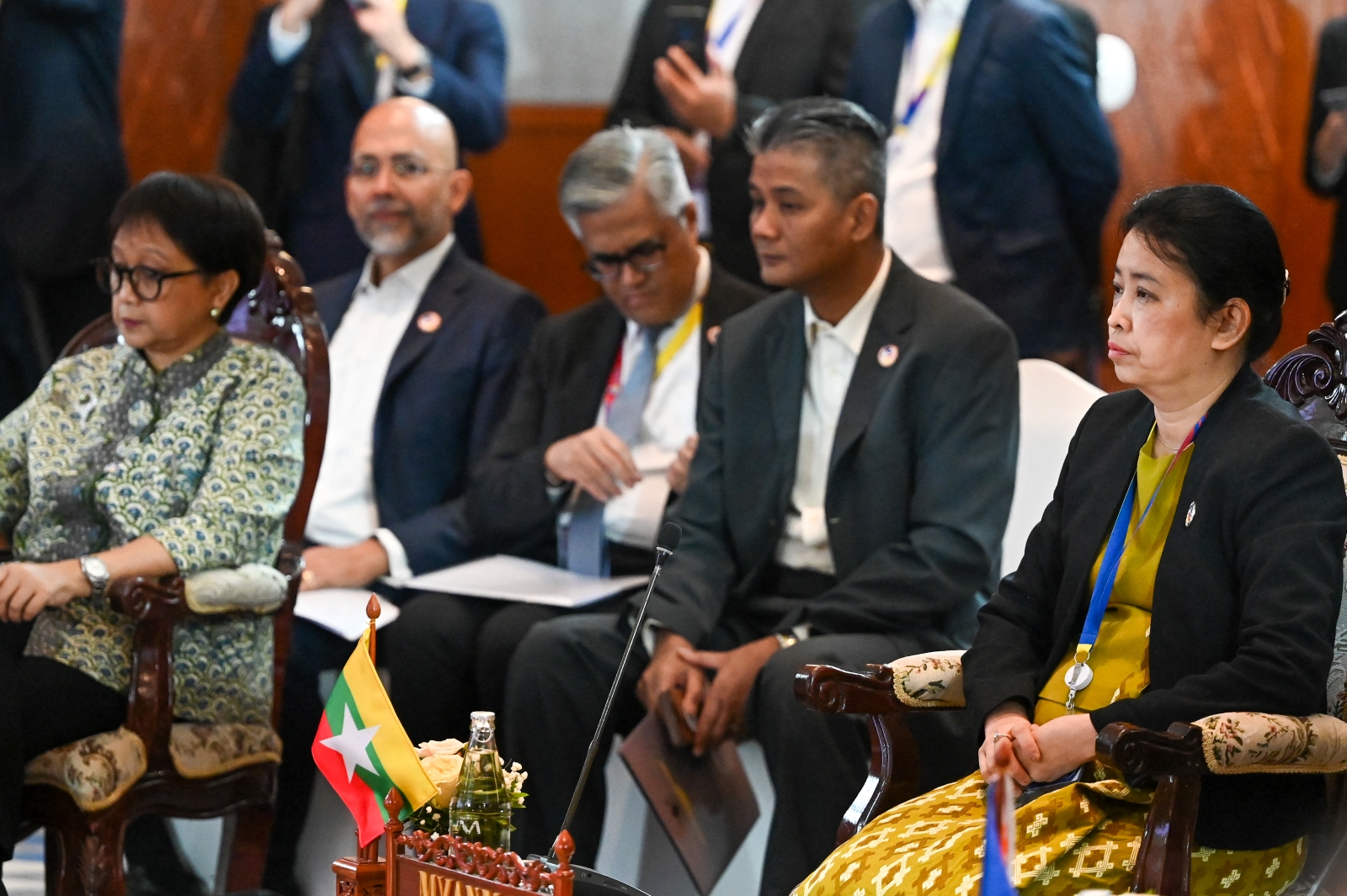 Myanmar permanent secretary Marlar Than Htike, on the right, and Indonesia's foreign minister Retno Marsudi, on the left, sit during the ASEAN Foreign Ministers' retreat meeting in Luang Prabang on January 29. (AFP)