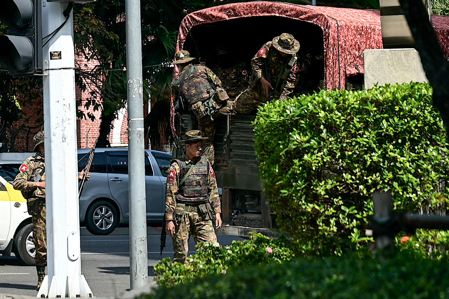 Soldiers patrol in Yangon during a "silent strike" marking the third anniversary of the military coup on February 1. (AFP)