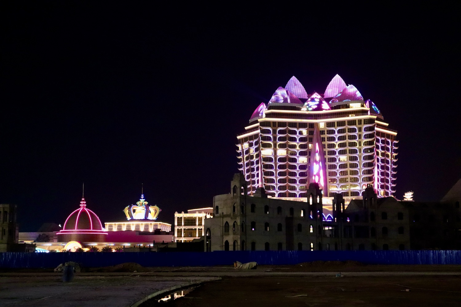 The Kapok Star Hotel and attached casinos beside vacant lots and unfinished buildings in Laos's Golden Triangle Special Economic Zone in June last year. (Andrew Nachemson | Frontier)