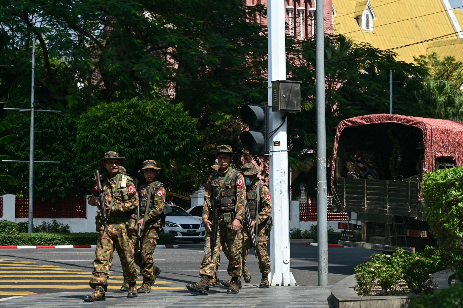 Soldiers patrol a street in Yangon during a “silent strike” to protest the military coup on its third anniversary on February 1. (AFP)