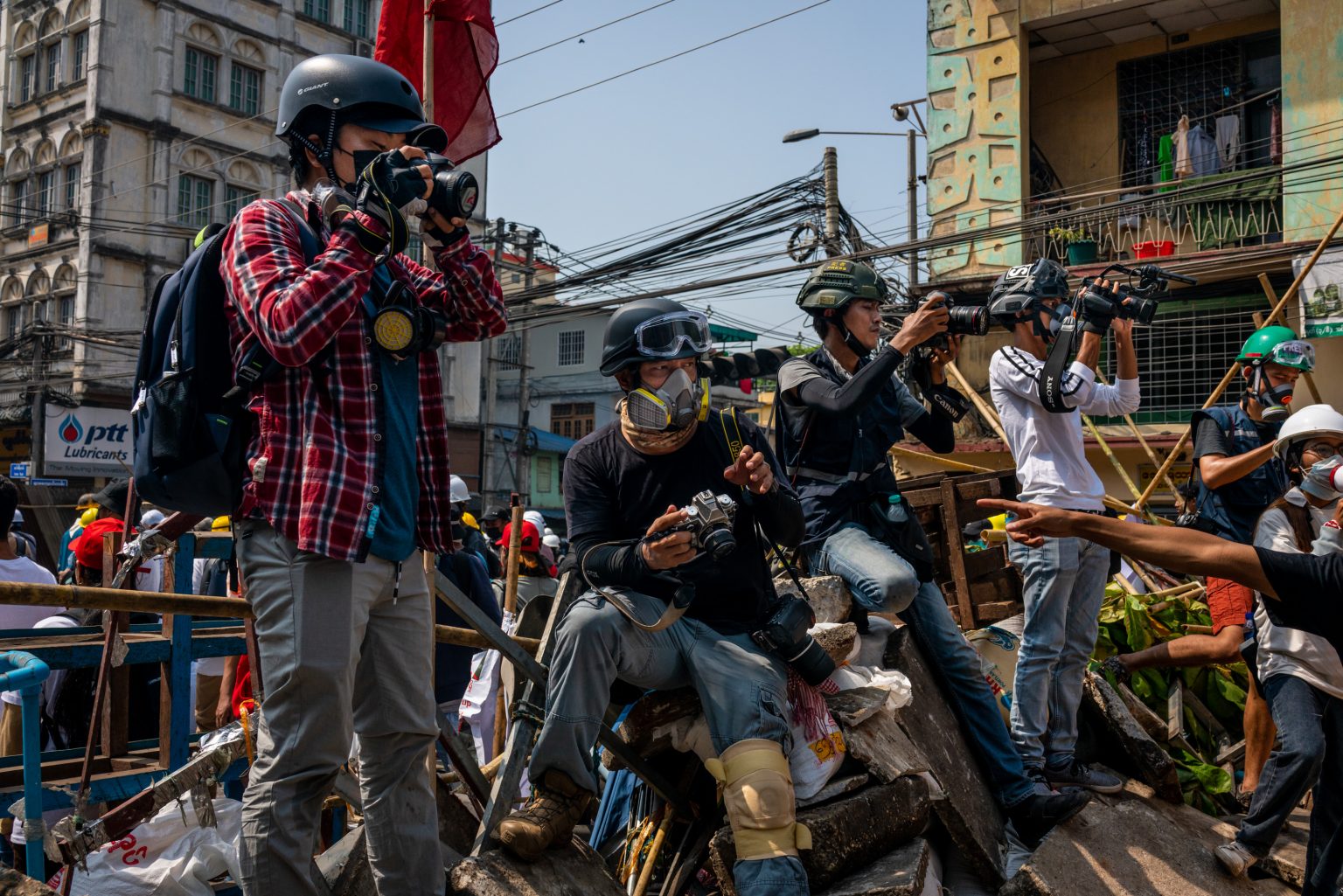 Journalists covering an anti-coup protest in Yangon's Hlaing Township in March 2021. (Frontier)