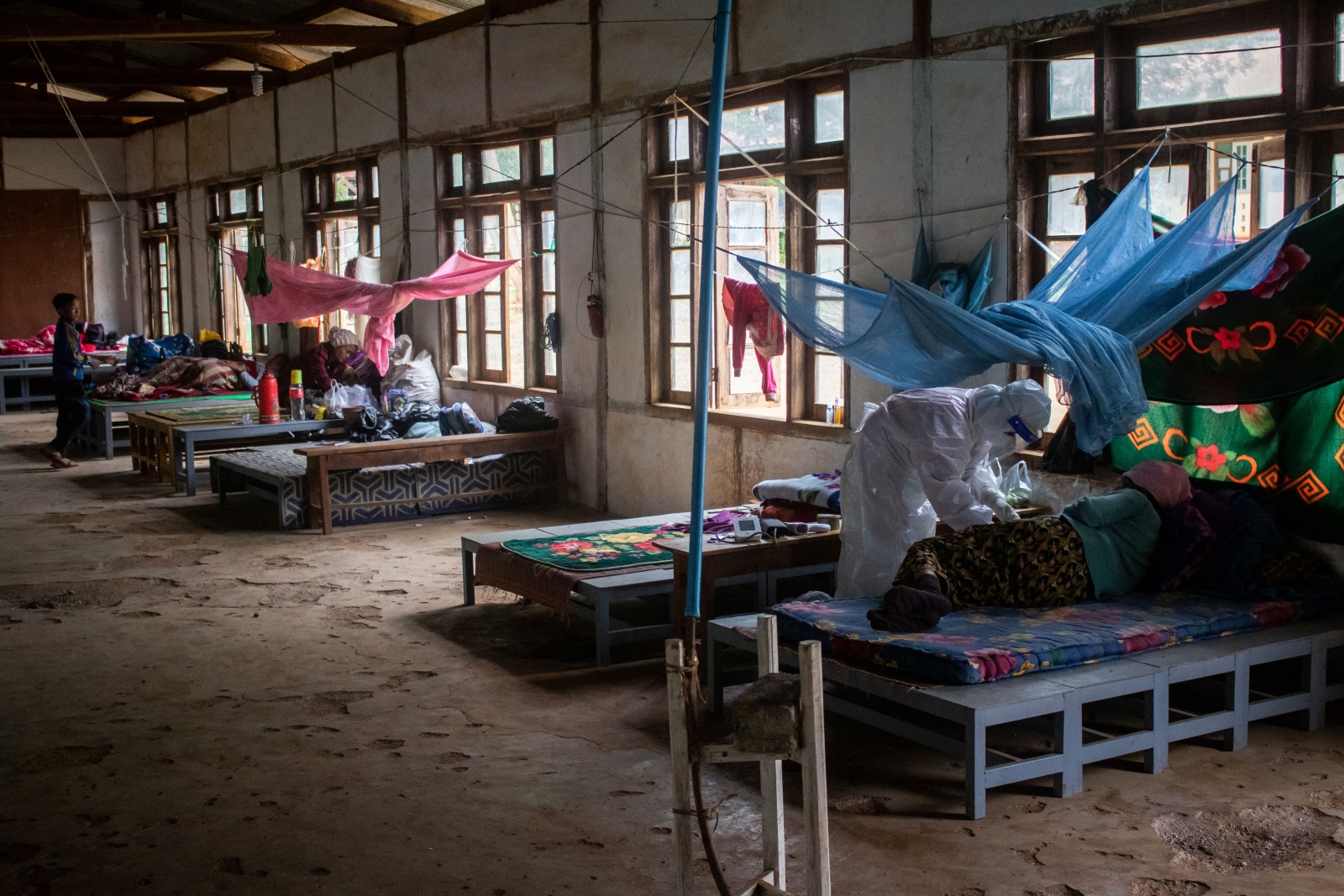 Volunteer healthcare workers treat patients at a clandestine clinic in Kayah State’s Demoso Township on October 17, 2021. (AFP)