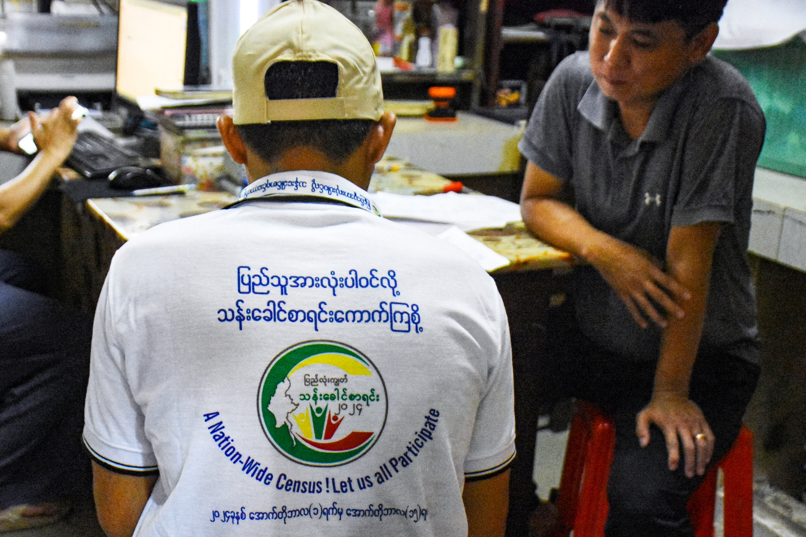 An enumerator collects household data during the census in Nay Pyi Taw on October 1. (AFP)