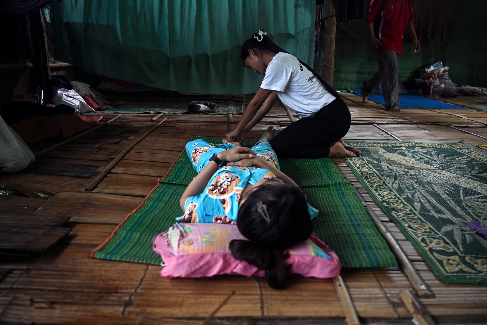 A recovering drug addict from Myanmar gets a therapeutic massage during a rehabilitation programme run by the organisation Drug and Alcohol Recovery and Education in the Thai border town of Mae Sot on September 10. (AFP)