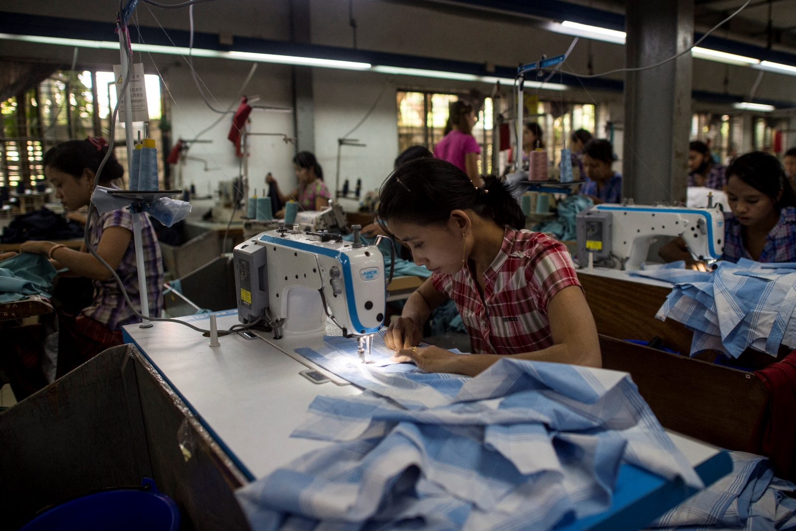 Workers sew at a garment factory in Yangon on November 1, 2018. (AFP)