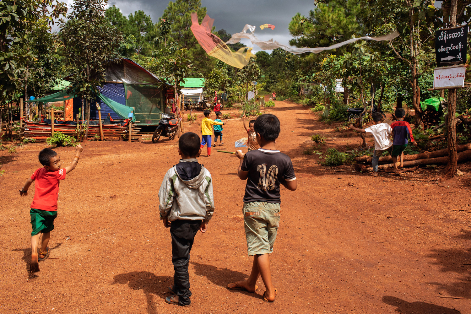 Children play at a camp for internally displaced people in Kayah State's Demoso Township in October 2023. Mental health practitioners worry about the mental burden of the post-coup conflict on Myanmar's youth. (AFP)