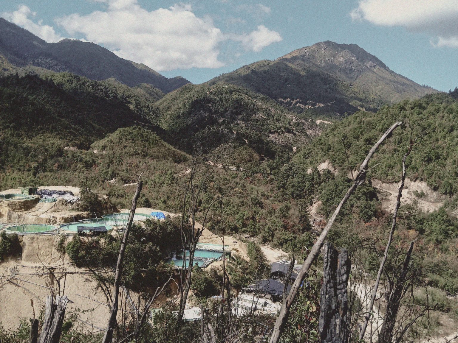 Pools of chemicals used to extract rare earths from the hills of Kachin State along the border with China, seen in 2021. (Supplied)