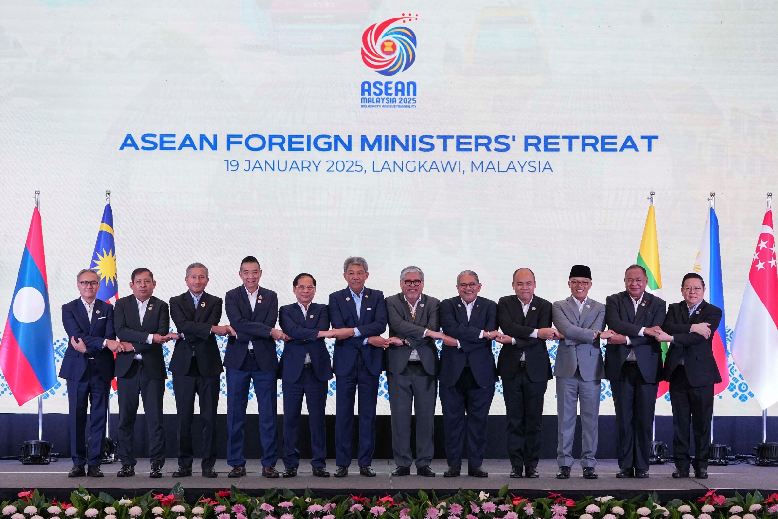 Top ASEAN diplomats, accompanied by the junta’s permanent secretary to the bloc Aung Kyaw Moe (second on the left), pose for a group photo during the ASEAN Foreign Ministers' Retreat on Malaysia's Langkawi island on January 19. (AFP)