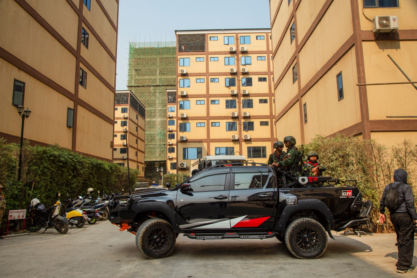 Members of the Kayin State Border Guard Force take part in a crackdown on cyber scam centres in Shwe Kokko town, in Kayin State’s Myawaddy Township, on February 18. (AFP)
