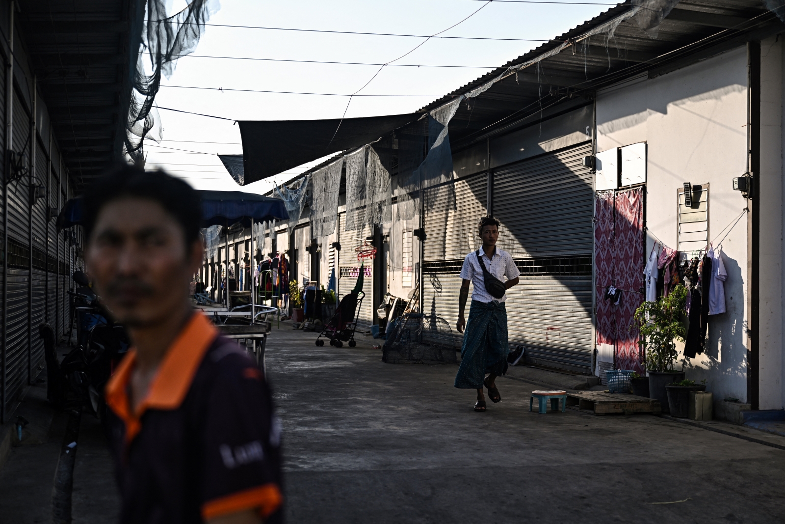 Myanmar migrant workers outside their accommodations in Thailand’s Samut Sakhon province on January 26. (AFP)