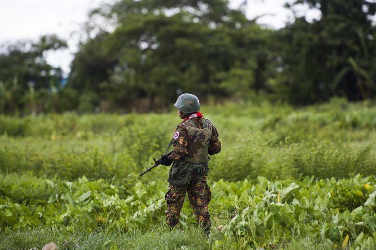 A Myanmar soldier guards an area at Sittwe airport in Rakhine State on September 20, 2018. (AFP)