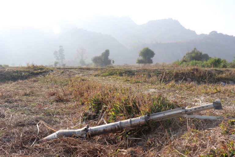 An unexploded ammunition lies on a field in Rakhine State's Rathedaung Township in February 2019, after a fresh round of fighting between the Myanmar military and the Arakan Army, which on Monday confirmed it had abducted three candidates from the ruling National League for Democracy in the south of the state, weeks before the November election. (AFP)