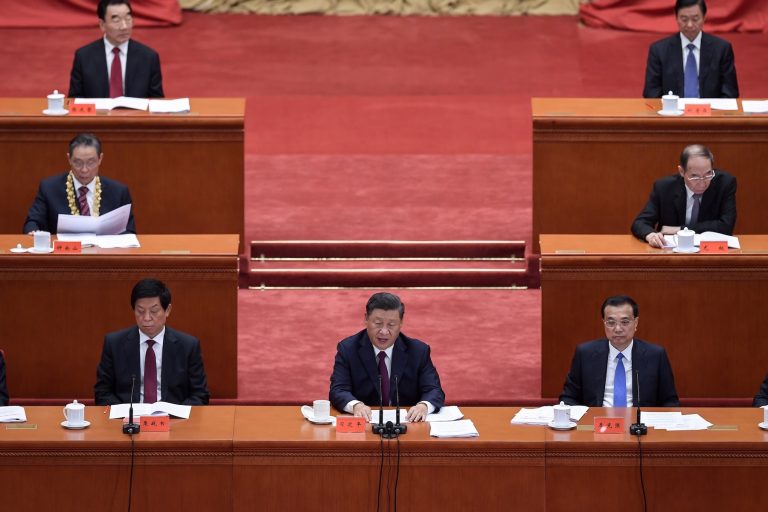 Chinese President Xi Jinping, center, delivers a speech at the Great Hall of the People in Beijing on September 8. (AFP)