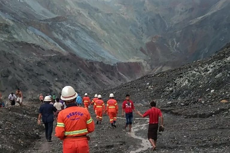 This handout from the Myanmar Fire Services Department taken and released on July 2, shows rescuers attempting to locate survivors after a landslide at a jade mine in Hpakant, Kachin State. (AFP | Myanmar Fire Services Department)