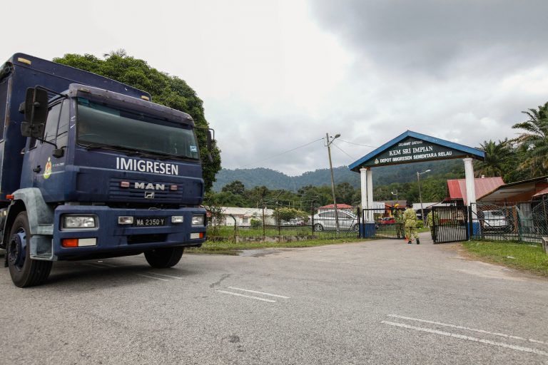 A Malaysian Immigration truck pictured in front of Sungai Bakap depot in Penang, where hundreds of Rohingya migrants escaped in April 2022. (AFP)