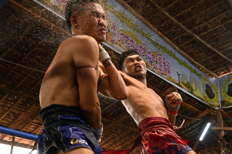 Fighters compete in a  lethwei bout at the Pyi Thar Lin Aye pagoda in Kayin State's Hlaingbwe Township on March 5. (AFP)