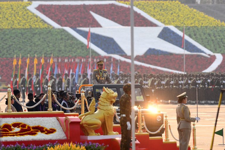 Coup leader Senior General Min Aung Hlaing parades in a vehicle at a ceremony to mark Armed Forces Day in Nay Pyi Taw on March 27. (AFP)