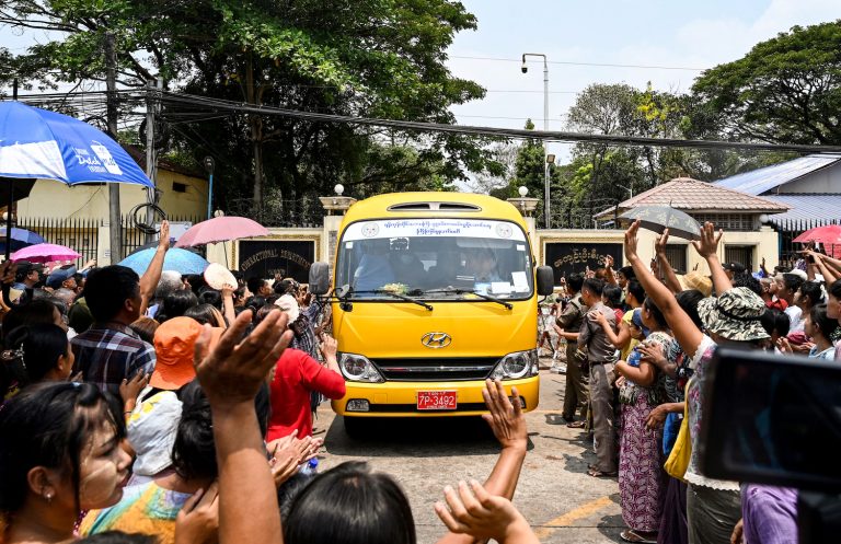 Relatives gather around a bus carrying prisoners being released from Yangon's Insein Prison on April 17, the Buddhist new year. (AFP)