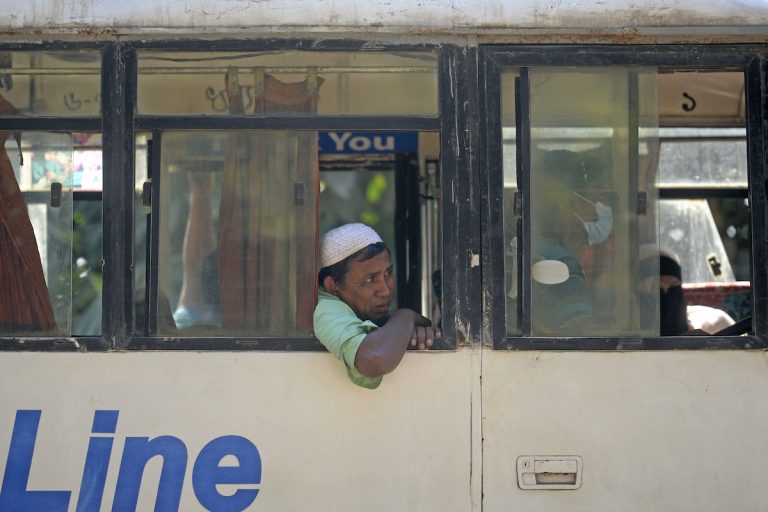 Rohingya refugees are being transported in a bus to the Chittagong port from a refugee camp for the first mass relocation of refugees to an island prone to cyclones and flooding on December 3. (AFP)