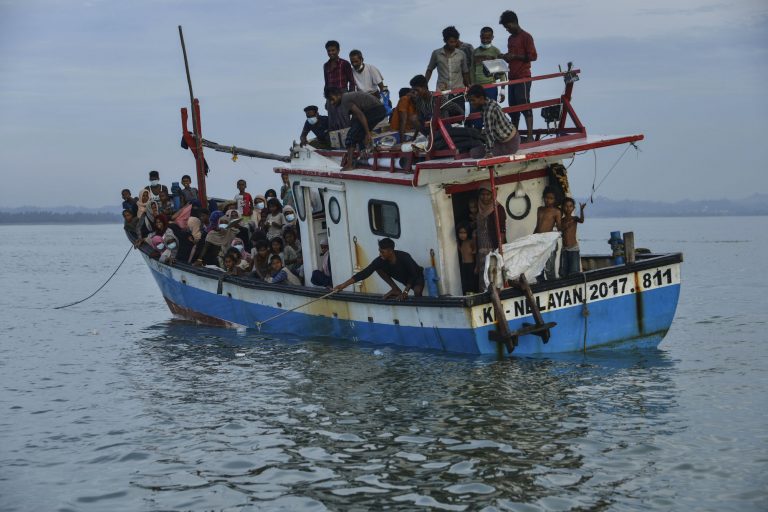 A boat carrying Rohingya refugees arrives in Indonesia's North Aceh Regency in 2020. (AFP)