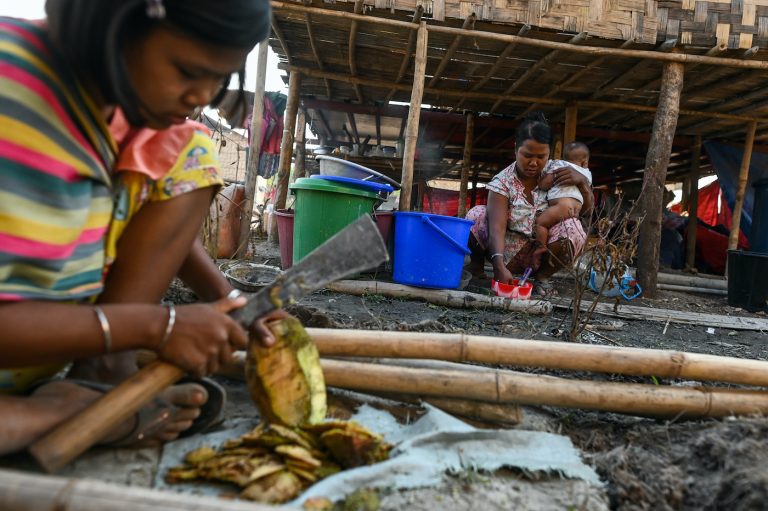 Chin people who fled conflict in southern Chin and northern Rakhine states prepare food in Bethel village, their new home in Yangon Region's Hmawbi Township, on January 11. (AFP)