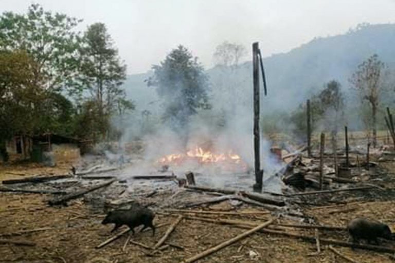 This handout from the Karen Information Center, taken and released to AFP on March 29, shows burning ruins in Day Bu No village in eastern Myanmar's Karen state, following an air strike after the Karen National Union seized a military base. (AFP)