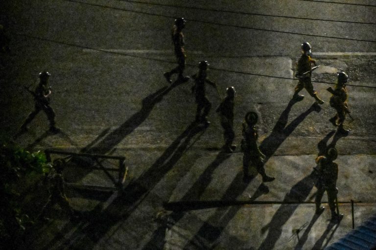 Soldiers patrol along a street in Yangon on April 2. (Frontier)