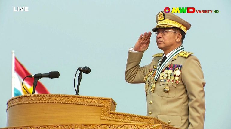 Screengrab of March 27, 2021 broadcast of Senior General Min Aung Hlaing saluting during an annual parade put on by the military to mark Armed Forces Day in Naypyidaw.(MRTV/AFP)