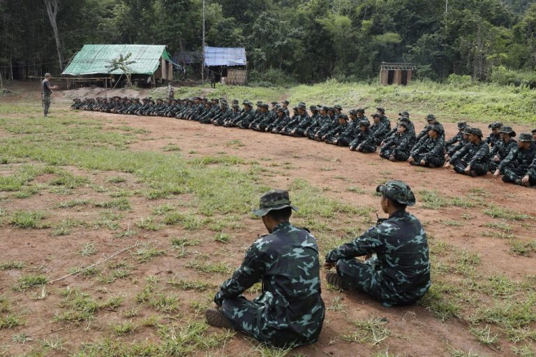 This photo taken on October 6, 2021 shows members of the People's Defence Force, the armed wing of the civilian National Unity Government opposed to Myanmar's ruling military regime, taking part in training at a camp in Kayin State, near the Myanmar-Thai border. (Photo by AFP)