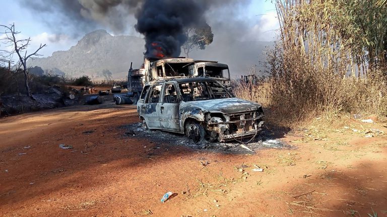 Burned vehicles pictured following a military massacre in Kayah State in 2021. 

(Handout/KNDF/AFP)