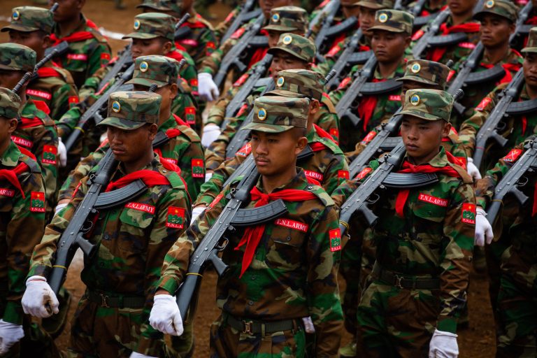 Ta'ang National Liberation Army soldiers parade to mark the 59th Ta'ang National Resistance Day in Tangyan Township, northern Shan State on January 12 last year. (AFP)