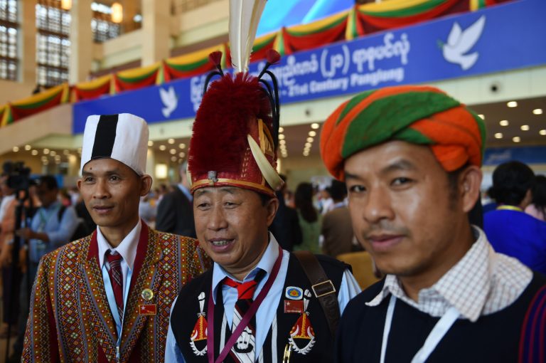 Chin, Naga and Pa-O representatives, wearing traditional costumes, pose for a picture during the opening of a peace conference in Nay Pyi Taw on August 31, 2016. (AFP)