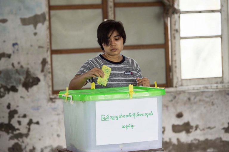 A woman casts her vote in a by-election in a polling station in eastern Yangon's Dagon Seikkan Township on April 1, 2017. (AFP)