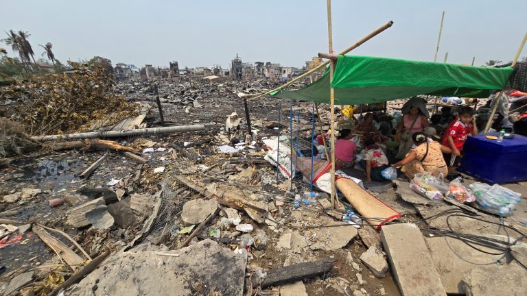 People sleep under a makeshift shelter in the Sein Pan neighbourhood of Mandalay’s Maha Aung Myay Township, where the March 28 earthquake destroyed more than 400 houses, on April 4. (Zaw Zaw | Frontier)