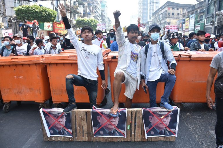 Protesters set up a makeshift barricade of wheelie bins in downtown Yangon on February 28. (Frontier)