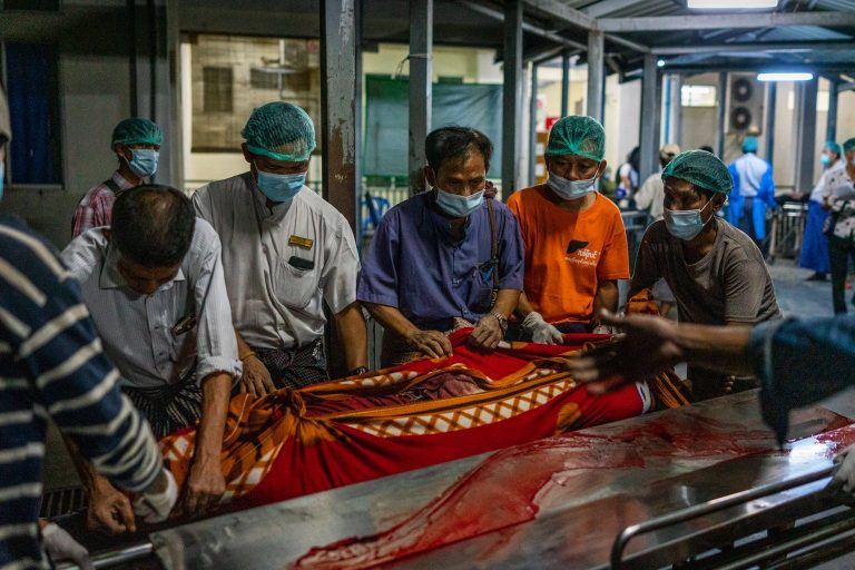 Workers at North Okkalapa Hospital carry the body of a person killed by security forces during a protest today. (Frontier)