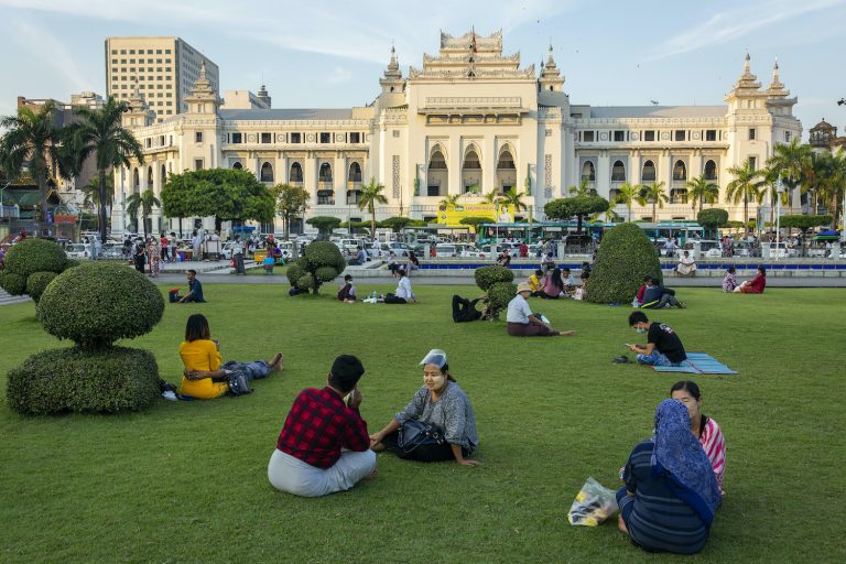 People congregate in downtown Yangon's Maha Bandoola Park on November 23, before the park was indefinitely closed. Outdoor spaces like parks offer relatively low-risk respites from stay-at-home orders, and can be a key public health tool, according to UN Habitat. (Hkun Lat | Frontier)