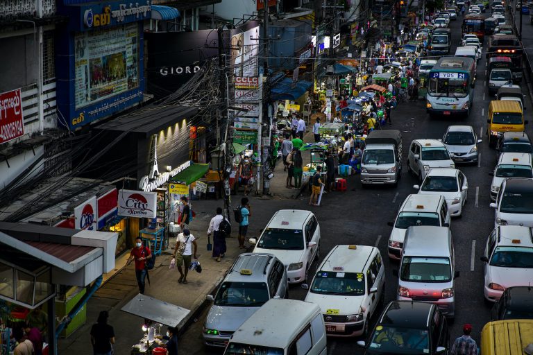 Drivers, pedestrians and vendors fill the streets of Yagon's Hledan Township, as in much of the rest of the city, on November 24, despite stay-at-home orders still officially remaining in effect. (Hkun Lat | Frontier)