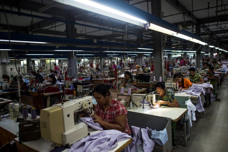 Workers sew at a garment factory in Yangon on November 1, 2018. (AFP)