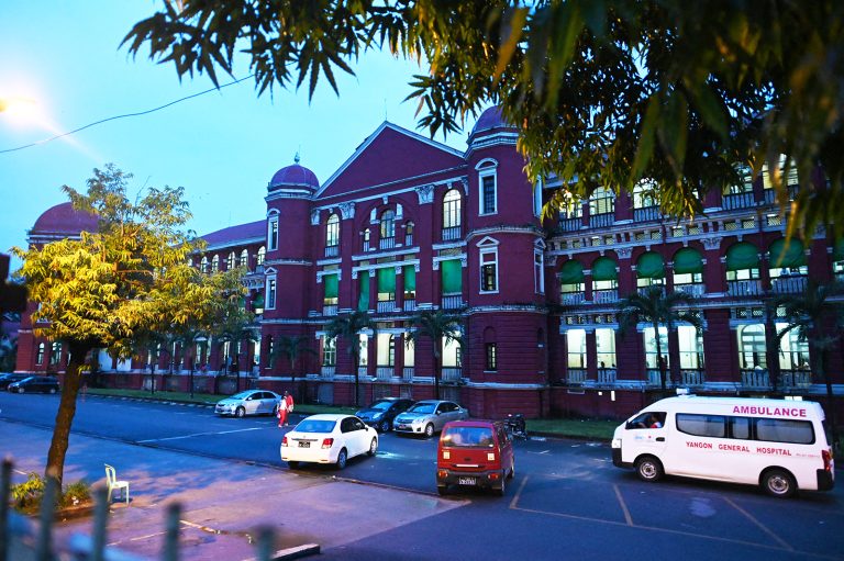 An ambulance passes Yangon General Hospital on June 19, 2019. (AFP)