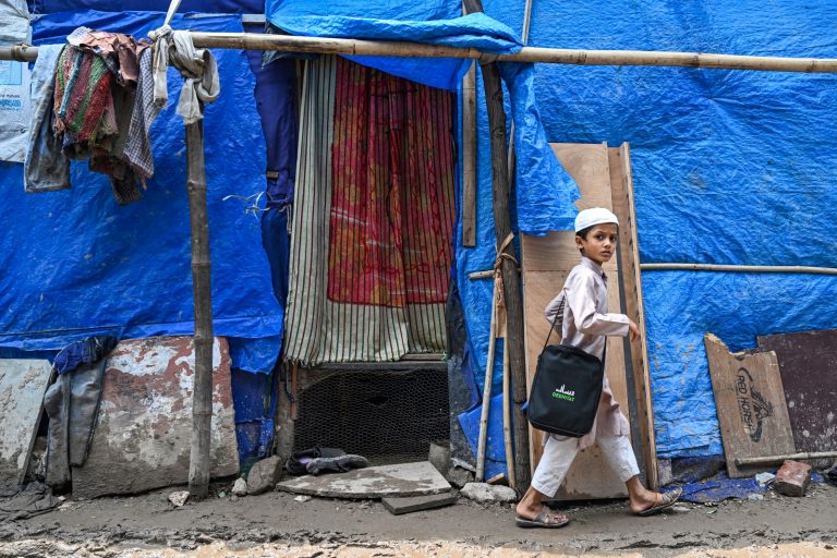 A Rohingya boy walks at a refugee camp in New Delhi on June 20, 2023. (AFP)