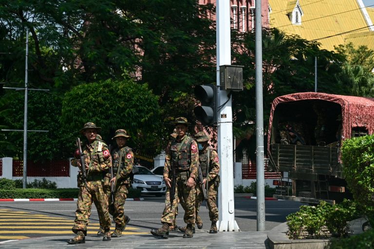 Soldiers patrol a street in Yangon during a “silent strike” to protest the military coup on its third anniversary on February 1. (AFP)