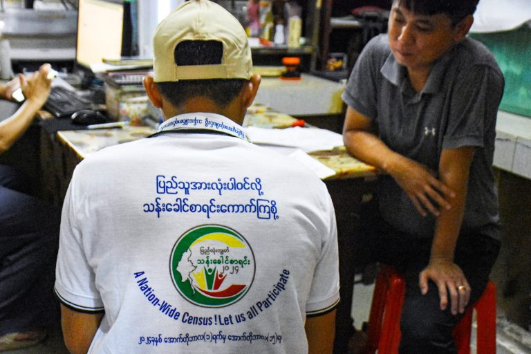 An enumerator collects household data during the census in Nay Pyi Taw on October 1. (AFP)