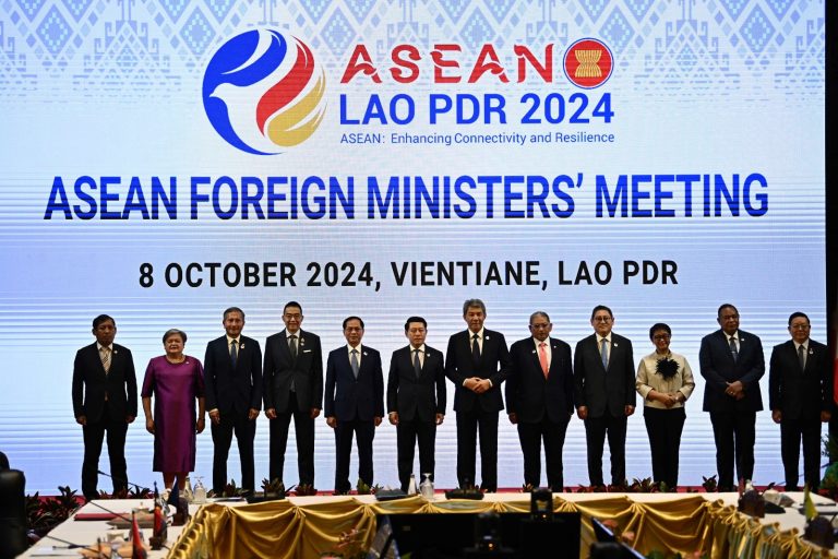 Myanmar Permanent secretary of foreign affairs Aung Kyaw Moe, on the far left, poses with the foreign ministers of ASEAN during the bloc’s Foreign Ministers Plenary Meeting session in Vientiane on October 8. (AFP)