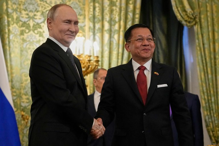 Russian President Vladimir Putin shakes hands with junta chief Senior General Min Aung Hlaing during their meeting at the Grand Kremlin Palace in Moscow on March 4. (AFP)