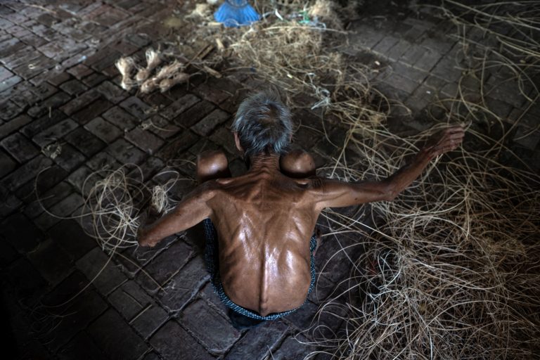 A man prepares cane to be weaved into a chinlone ball at a workshop in Ayeyarwady Region’s Hinthada Township on May 8. (AFP)