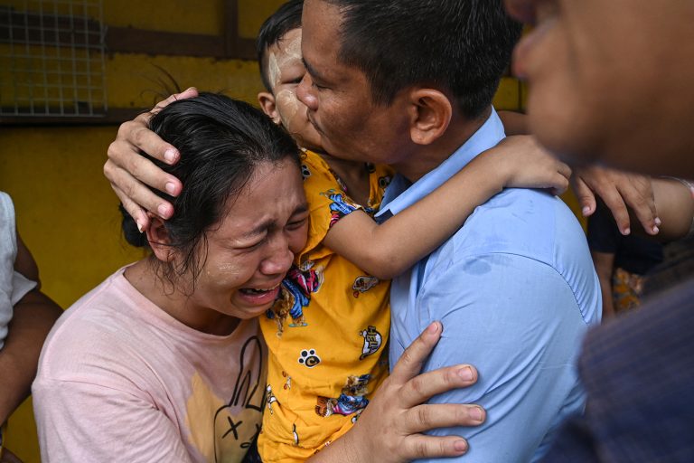 A man celebrates with his family after being released from Insein Prison in Yangon on May 3, 2023. (AFP)